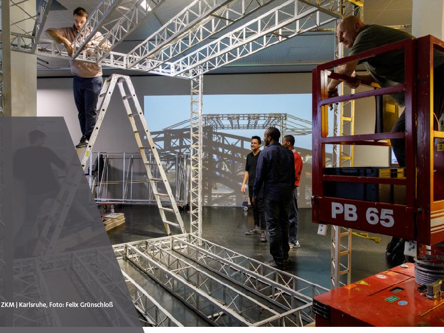 DK Osseo-Asare (center) and his team install their work in the ZKM | Center for Art and Media in Karlsruhe, Germany.