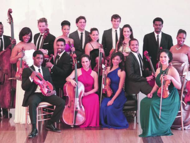 The diverse musicians of Sphinx Virtuosi post with their string instruments.