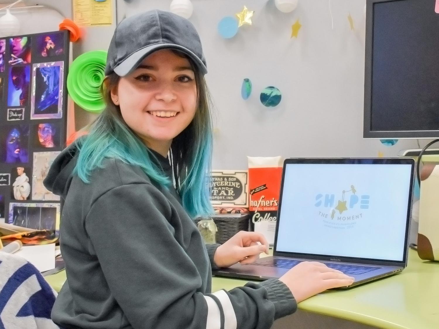 Haley Stipes in the graphic design studio
