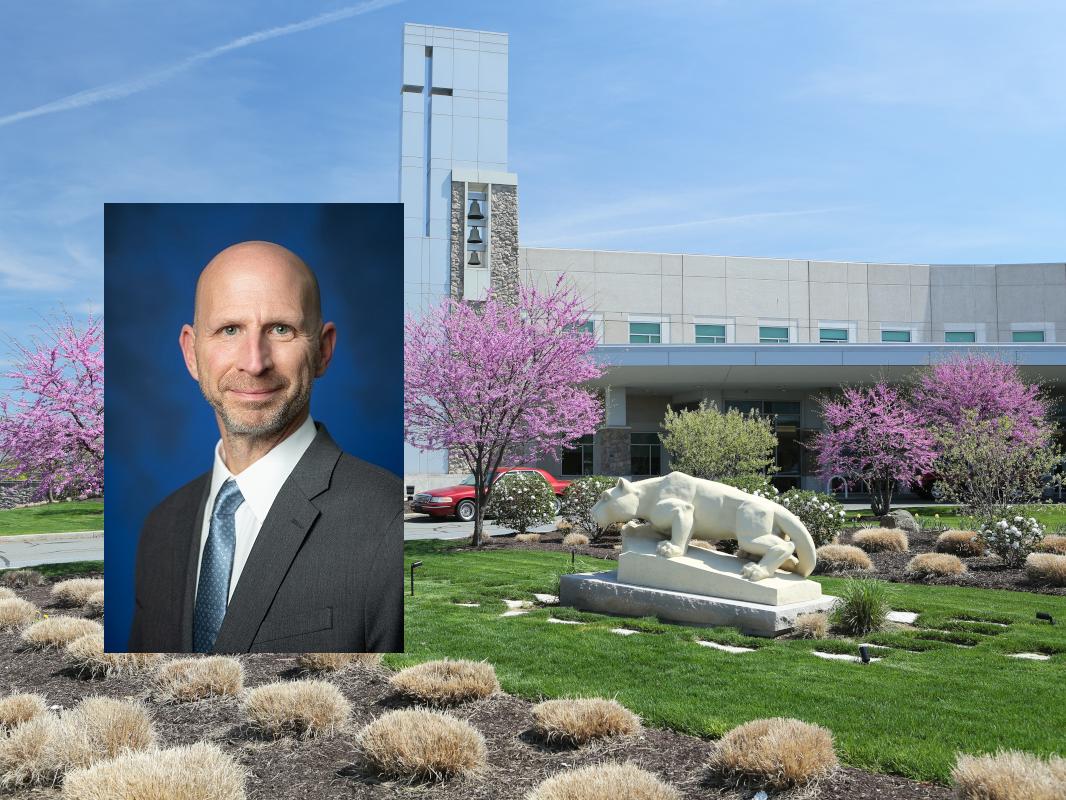 A headshot of James Bennett overlaid on a photo of a hospital exterior