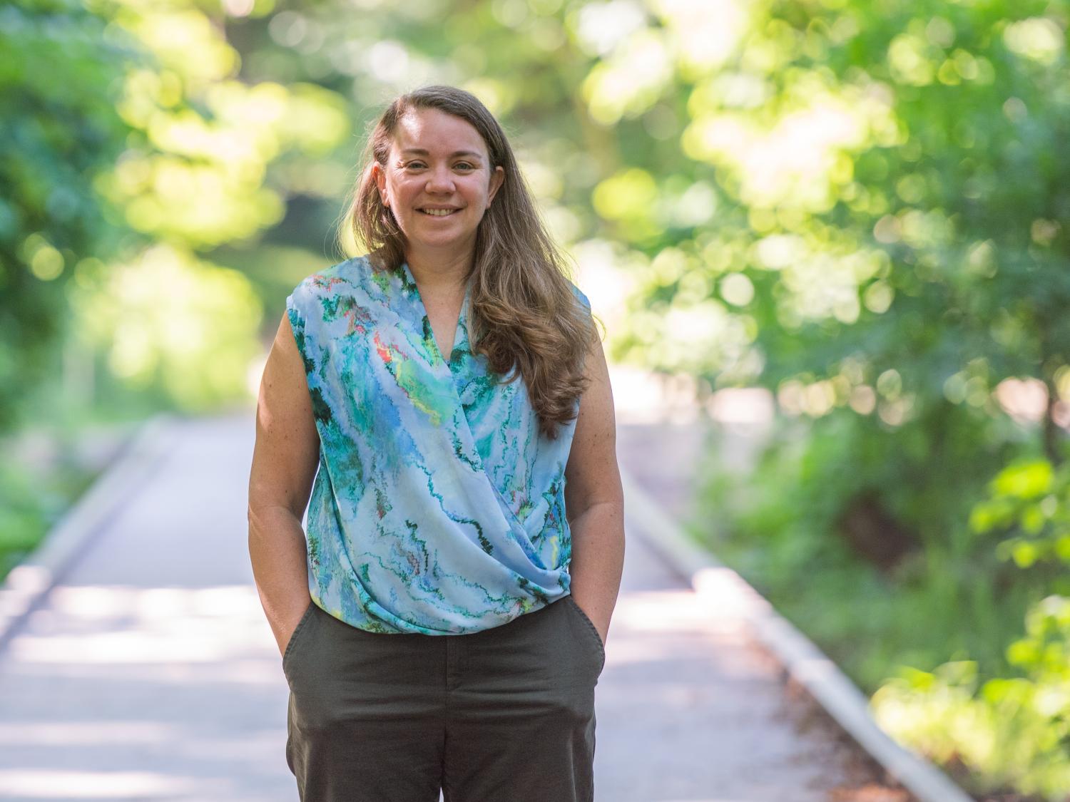 Sherri "Sam" Mason stands on a footbridge in Wintergreen Gorge