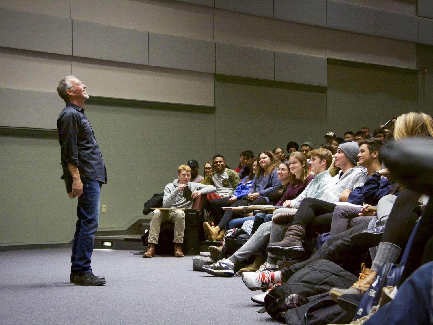 Sam Richards stands in front of his students in class