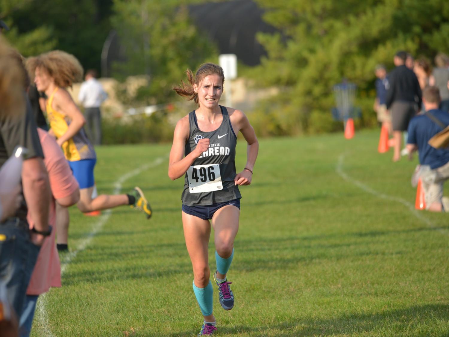 Penn State Behrend runner Savanna Carr competes in a cross country race.