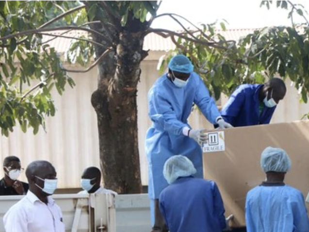 Researchers wearing full PPE