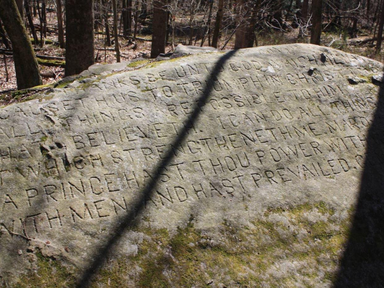 An inscribed rock at the Scripture Rocks site.