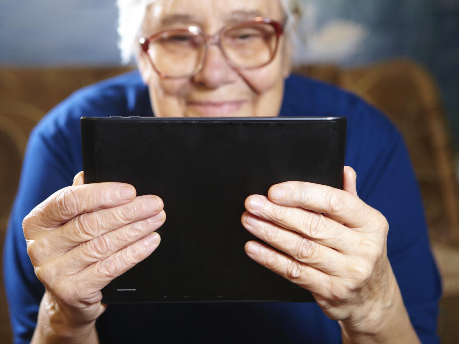 senior woman with tablet