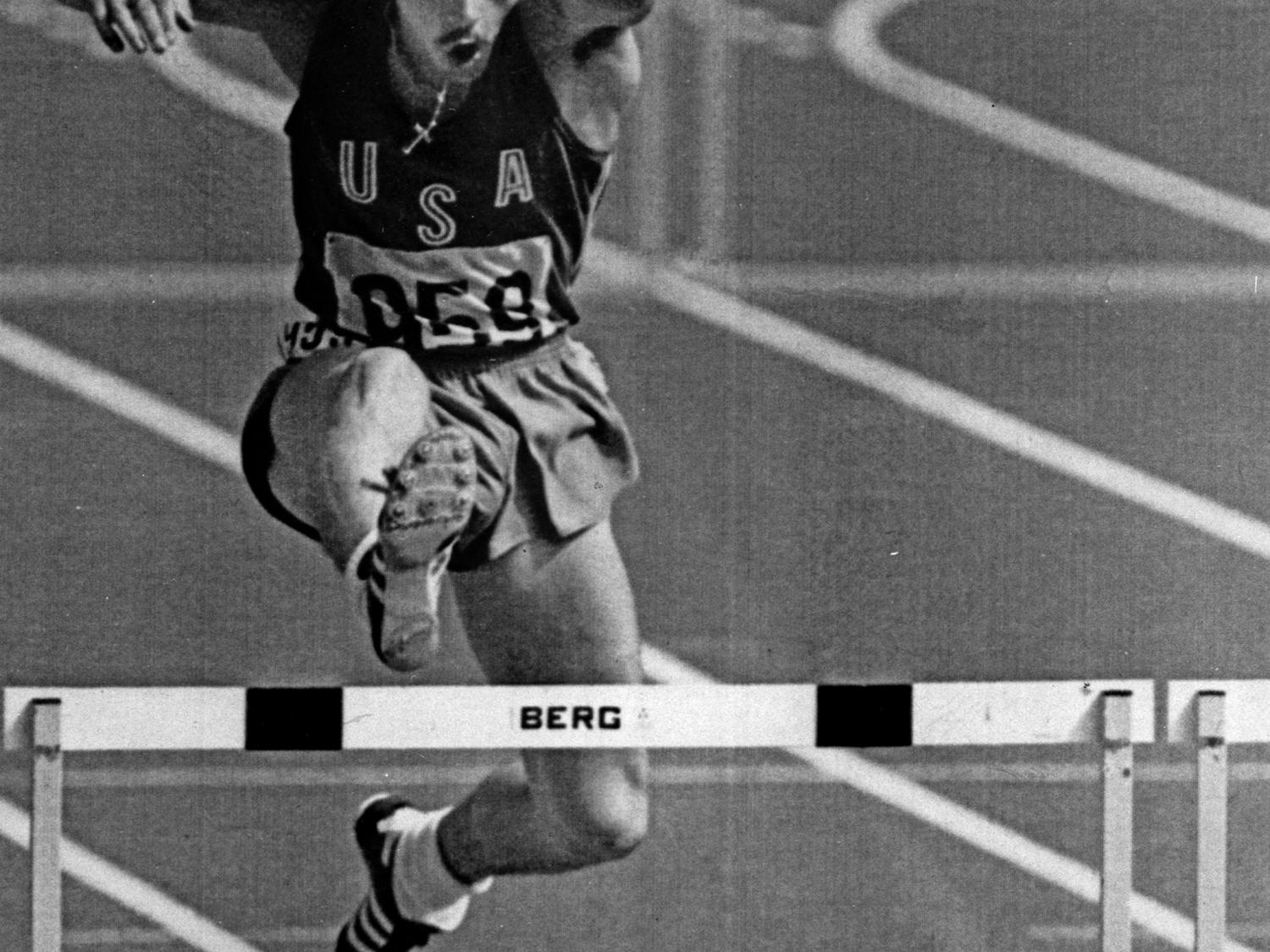 image of Penn State alumnus Mike Shine hurdling in the 1976 Montreal Summer Olympics