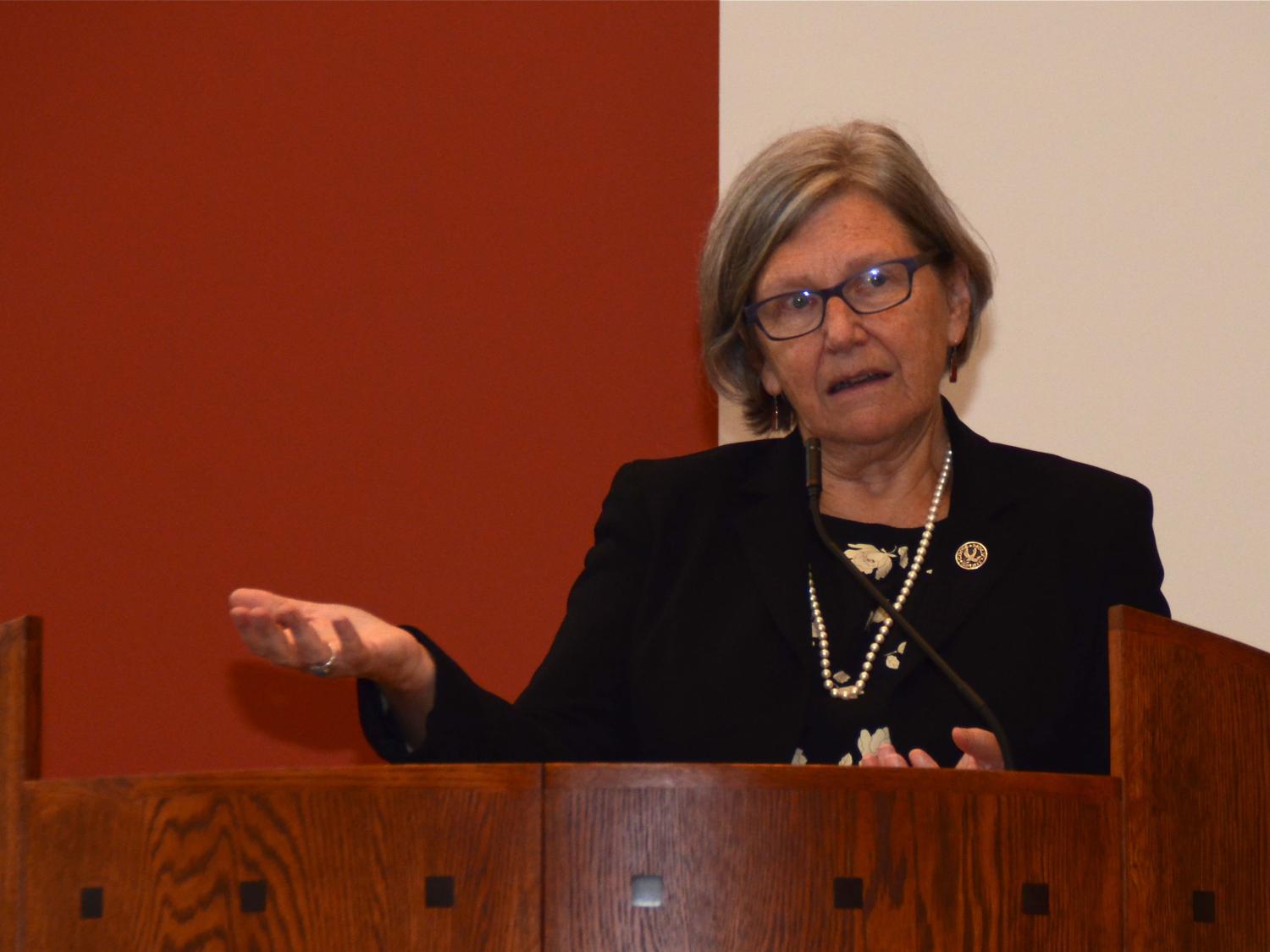 Sister Simone Campbell, executive director of NETWORK, standing and speaking at podium