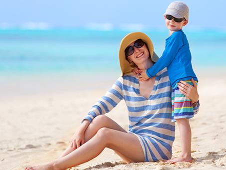 A woman and child on a beach