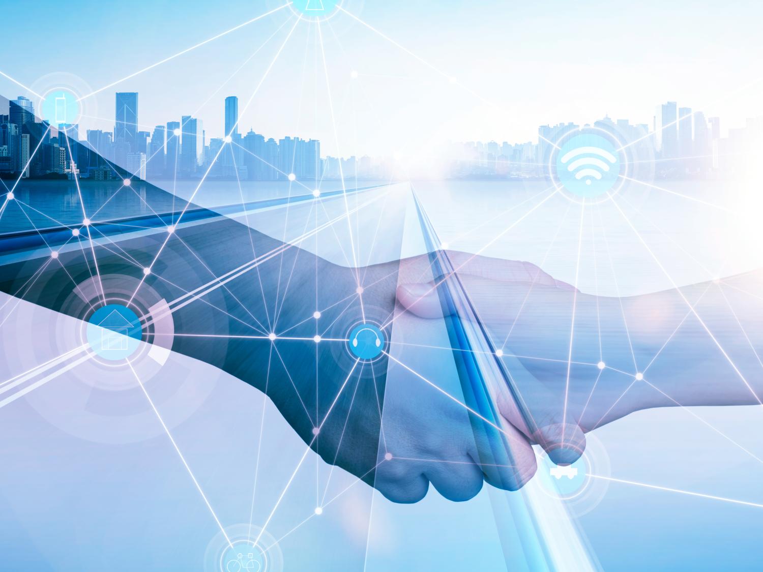 Hands shaking over a background of a road going to a smart city