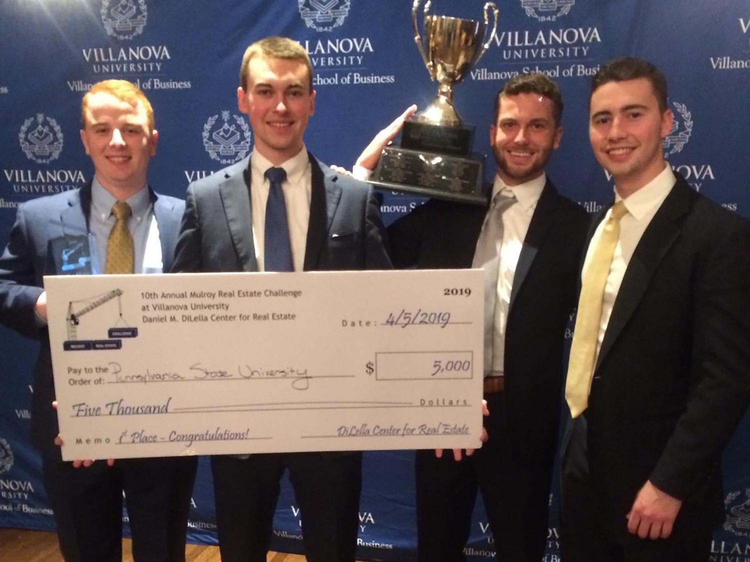 A photo of four Smeal seniors who won a real estate case competition.