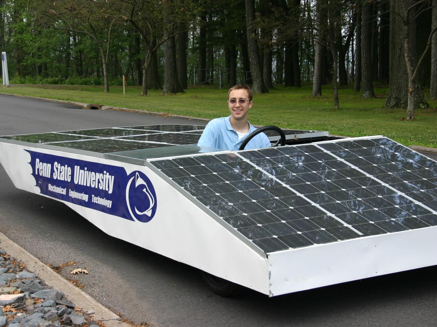 Alumni John Skopek takes a ride in a solar powered car built by students at Penn State Hazleton.