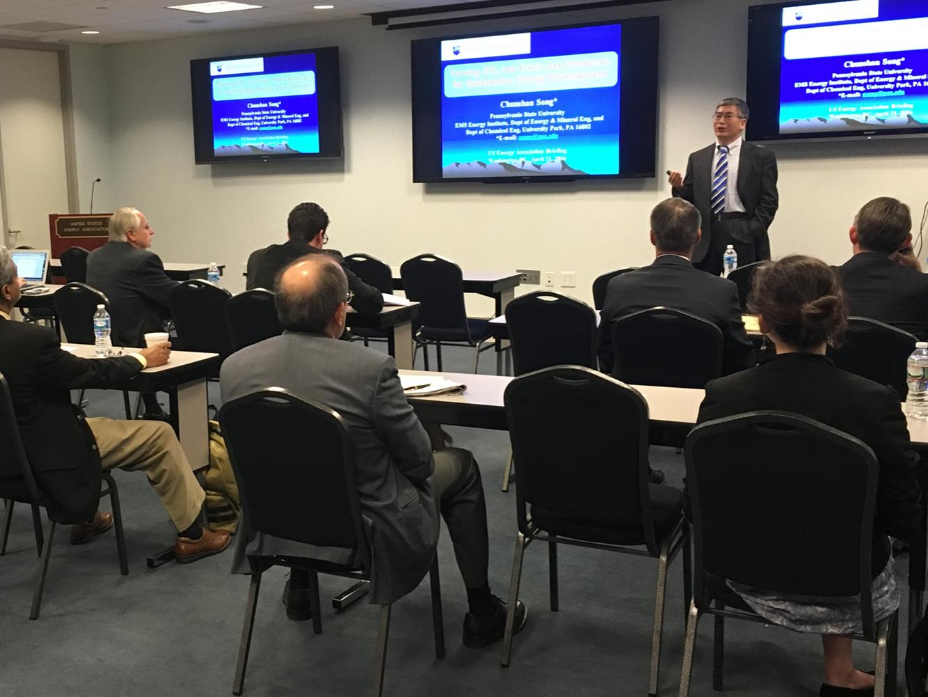 researcher presenting to group of people