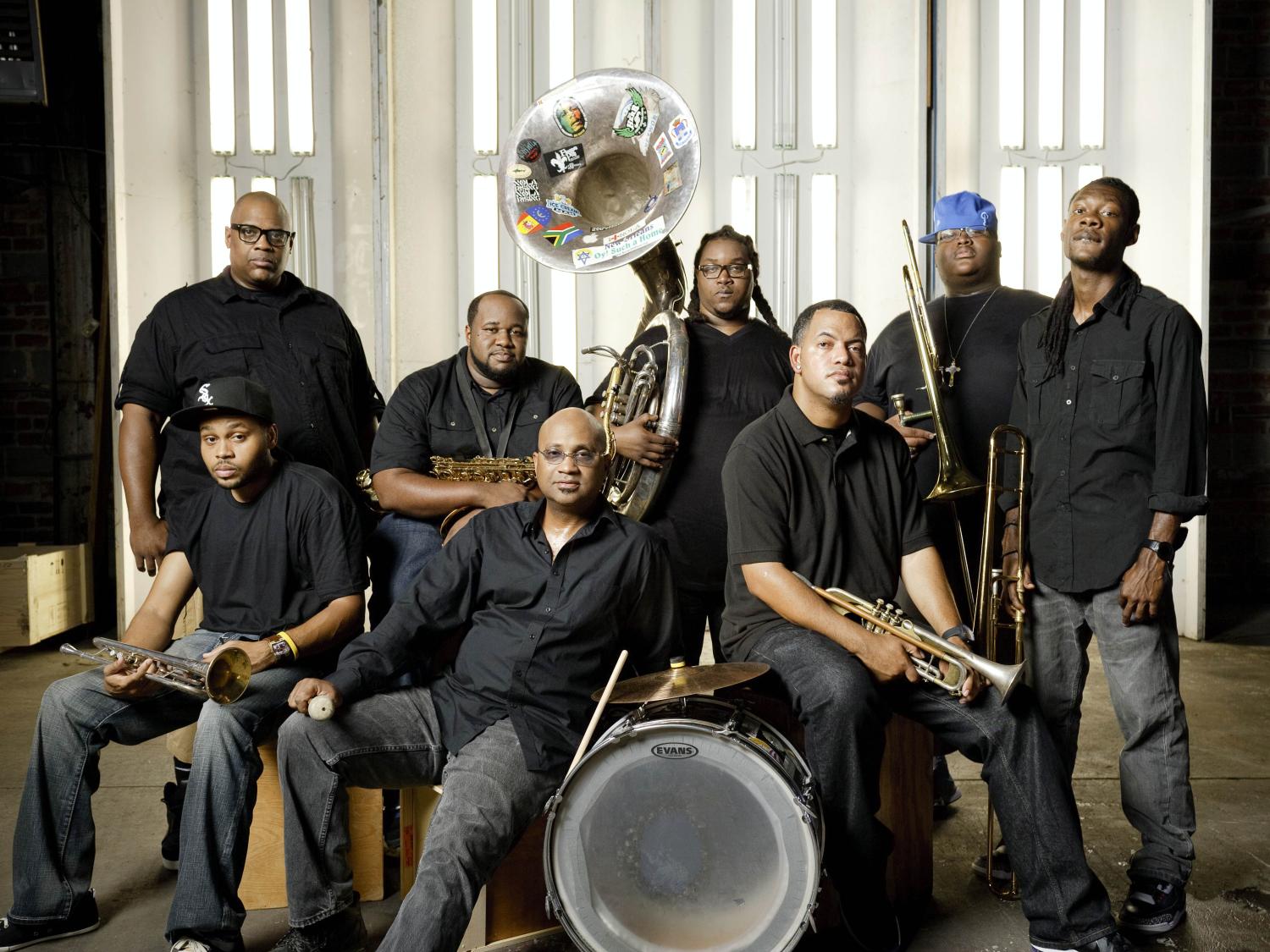 The Soul Rebels brass band musicans pose with their instruments.