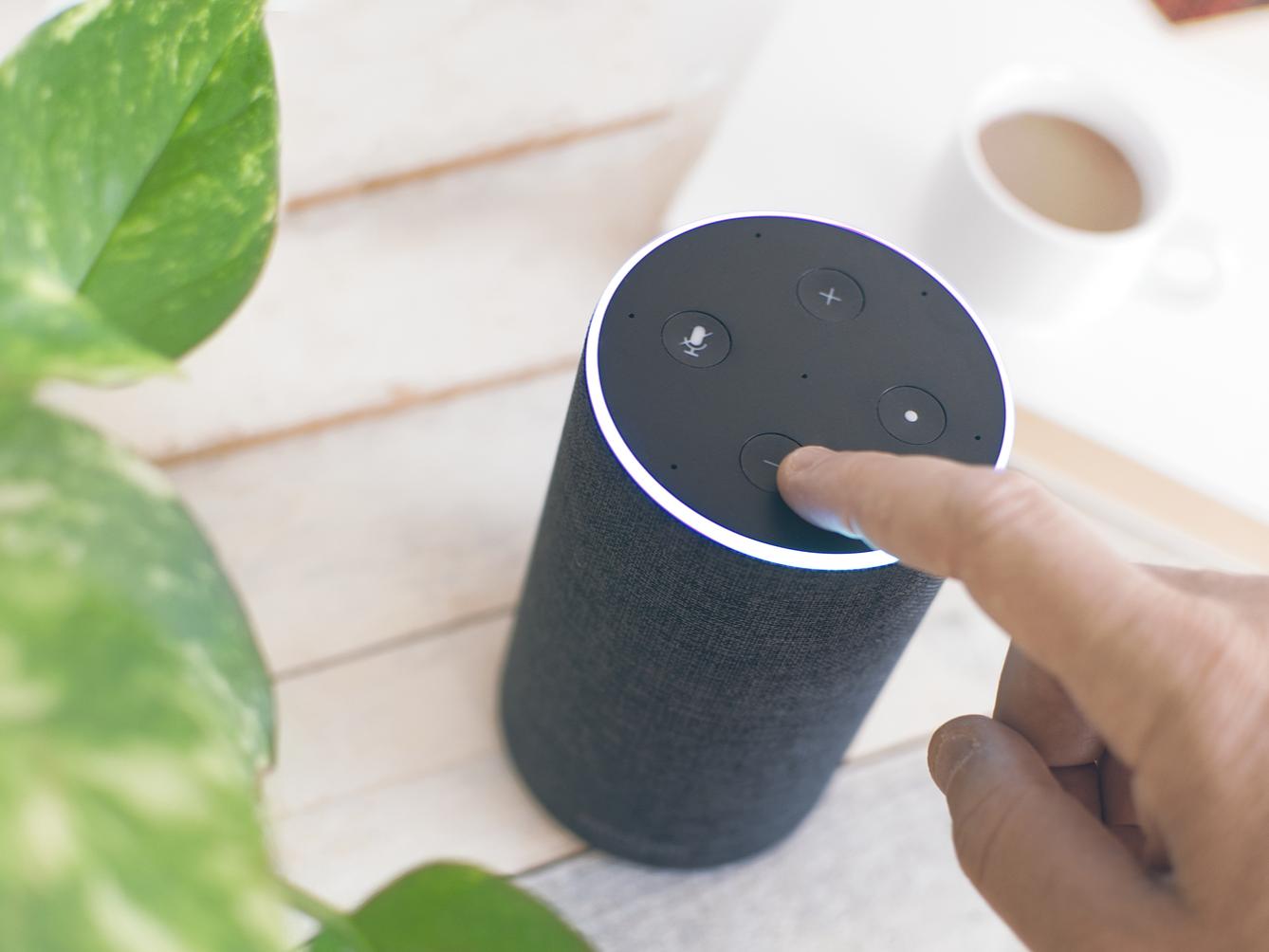 Someone powers on a smart speaker