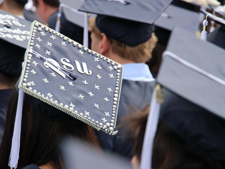 Penn State Berks student shows off their cap during graduation.