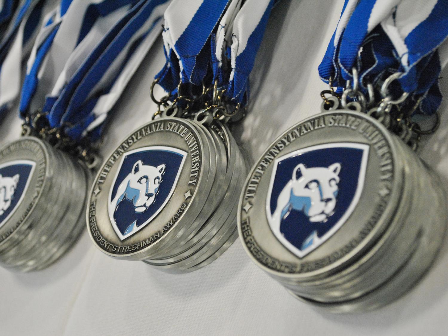 medals with Nittany Lion shield