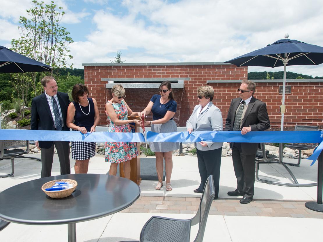 Campus leadership and donors cut ribbon on new student plaza.