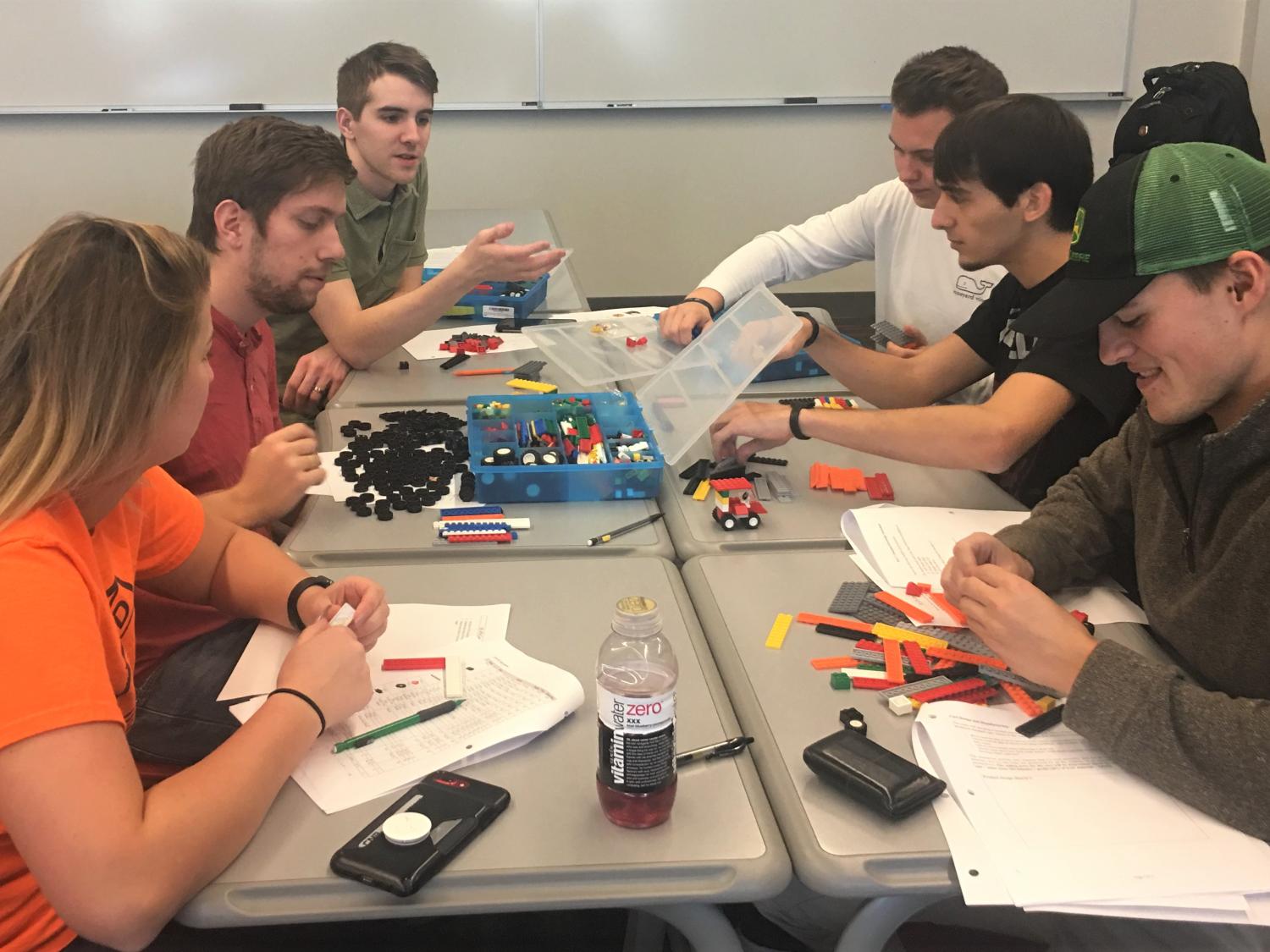 Students assemble Lego cars during a manufacturing simulation at Penn State Behrend.