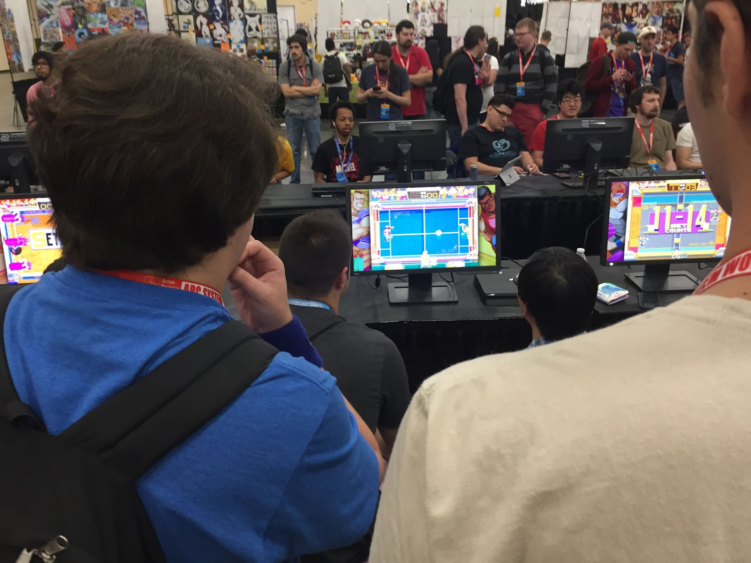 students watching others compete on computer