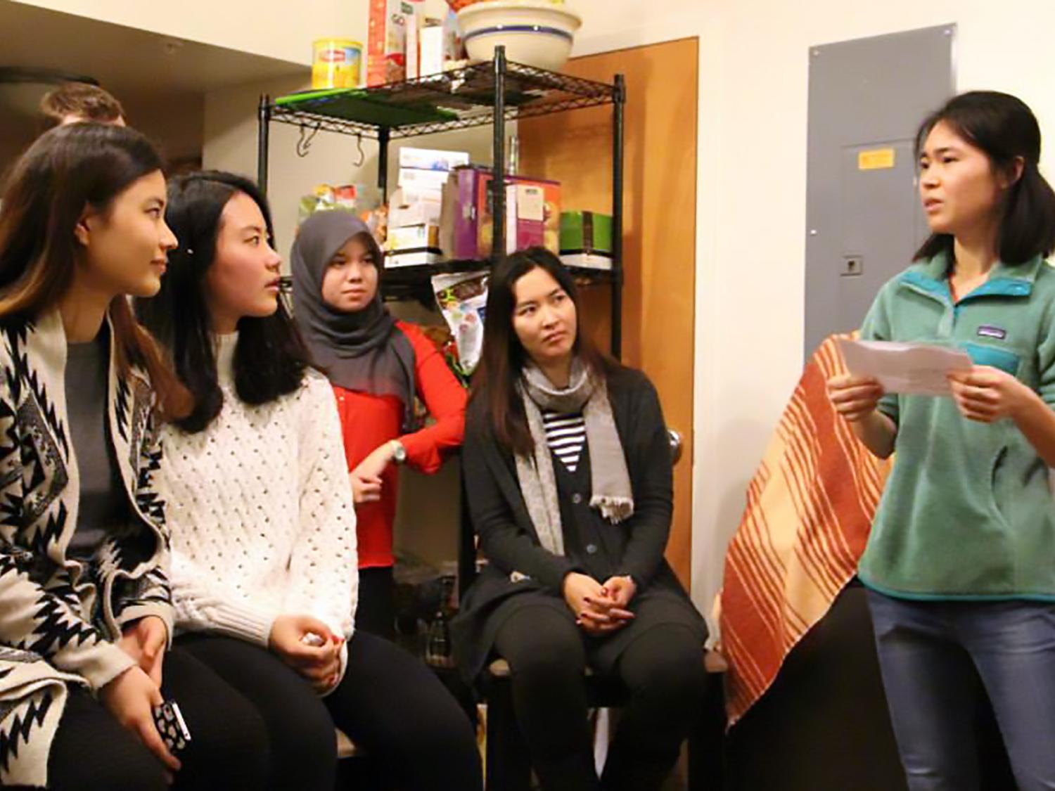 Penn State student Yanying Chen, founder of Global Integration, speaks during the student organization's multicultural night event.