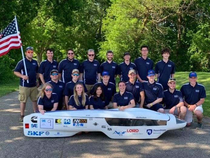 Penn State Behrend's SAE Supermileage team poses with their winning vehicle.