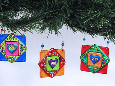 2016 commissioned ornaments, fused metallic acrylic, by Cathy Frank.