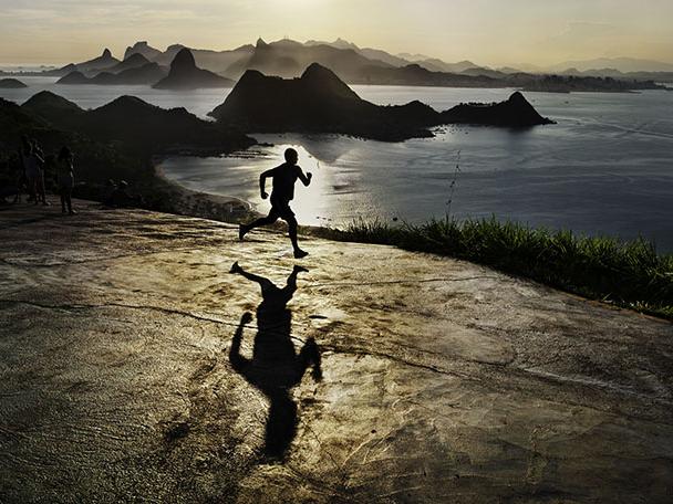 Steve McCurry, "Man Running at Dawn," Rio de Janeiro, Brazil, 2009, pigment print.