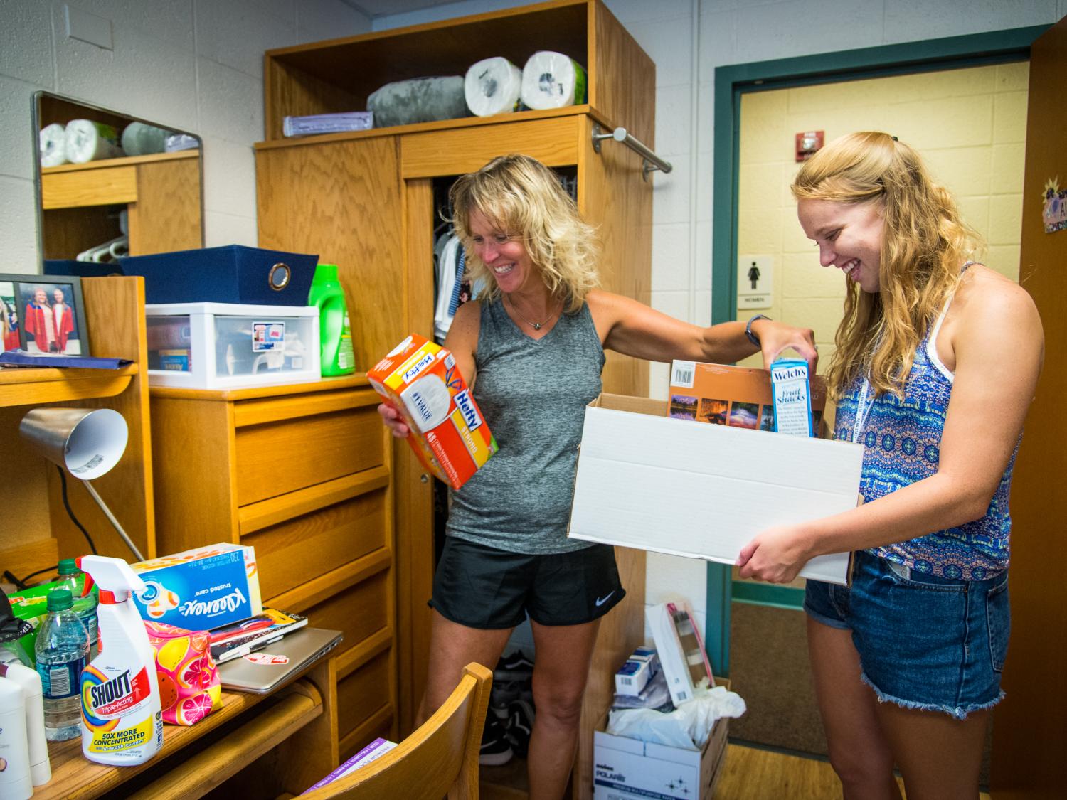 A student and her mother unpack in a Penn State Behrend residence hall.