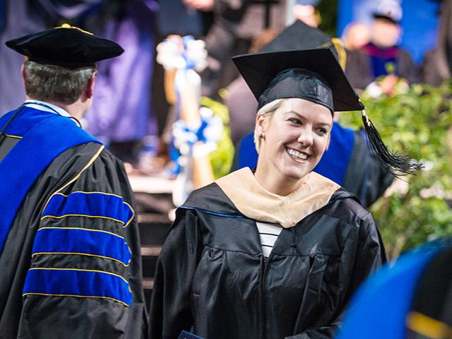 Female graduate of a Behrend master's degree program