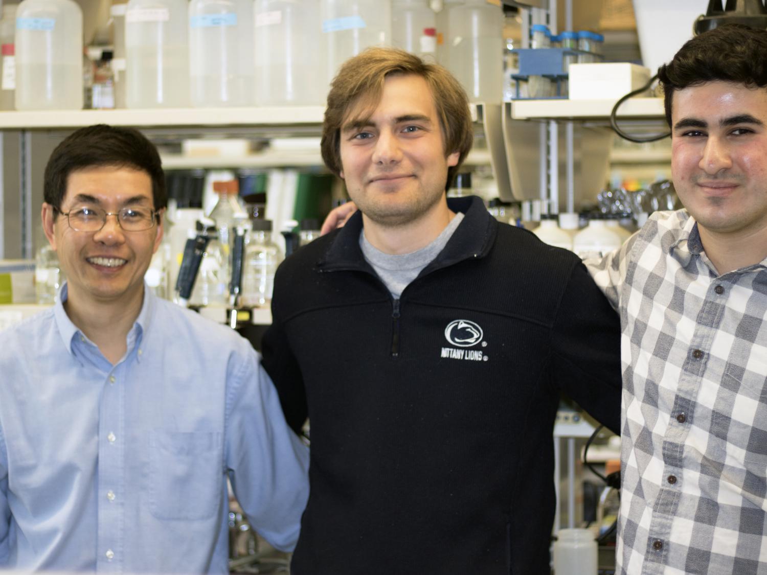 Professor Song Tan and Schreyer Scholars Turner Pecen and James Johnston