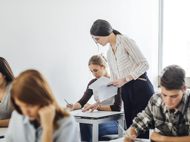 Teacher in high school classroom