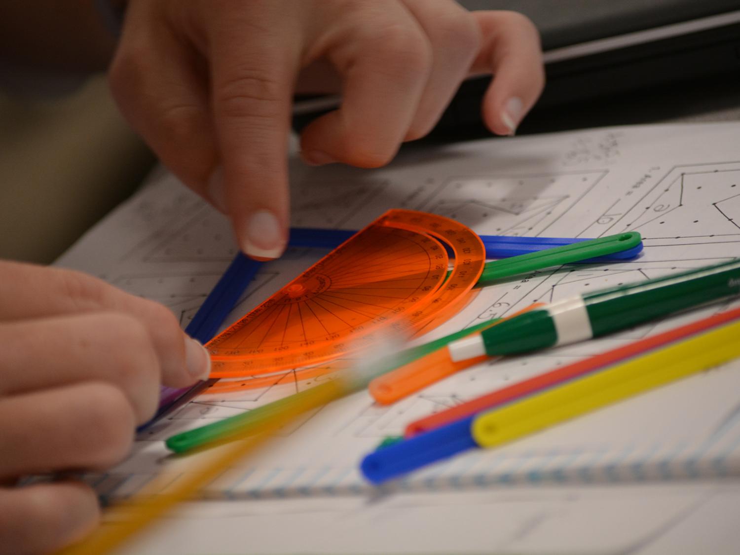 hands working with protractor