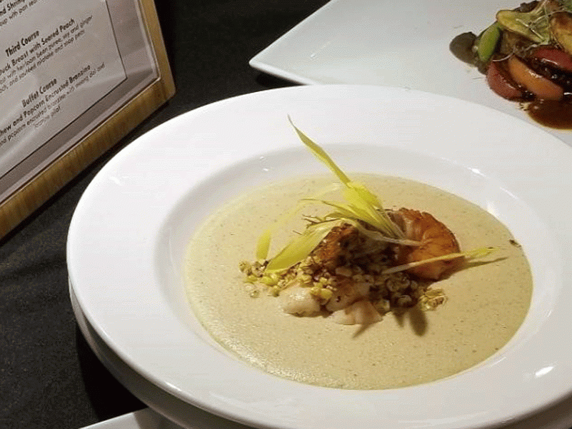 A bowl of corn and shrimp soup