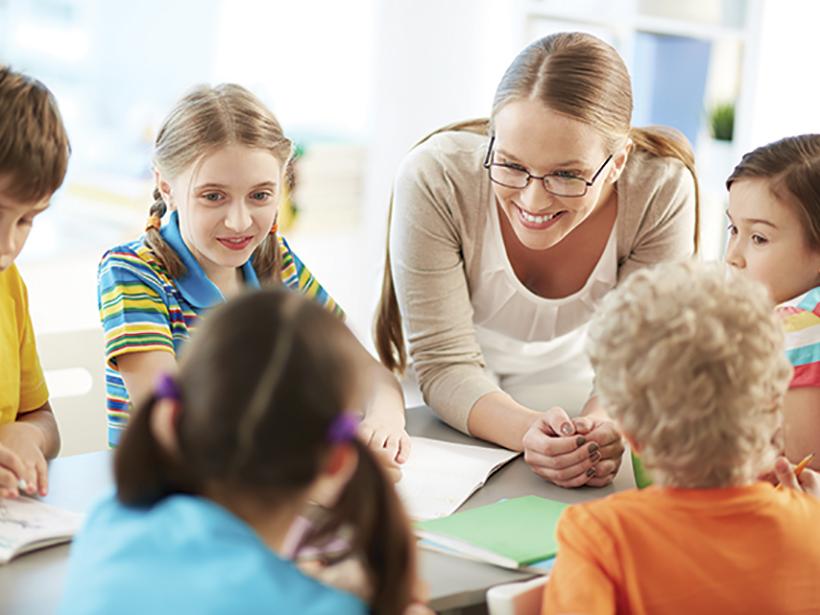 Teacher talking with students