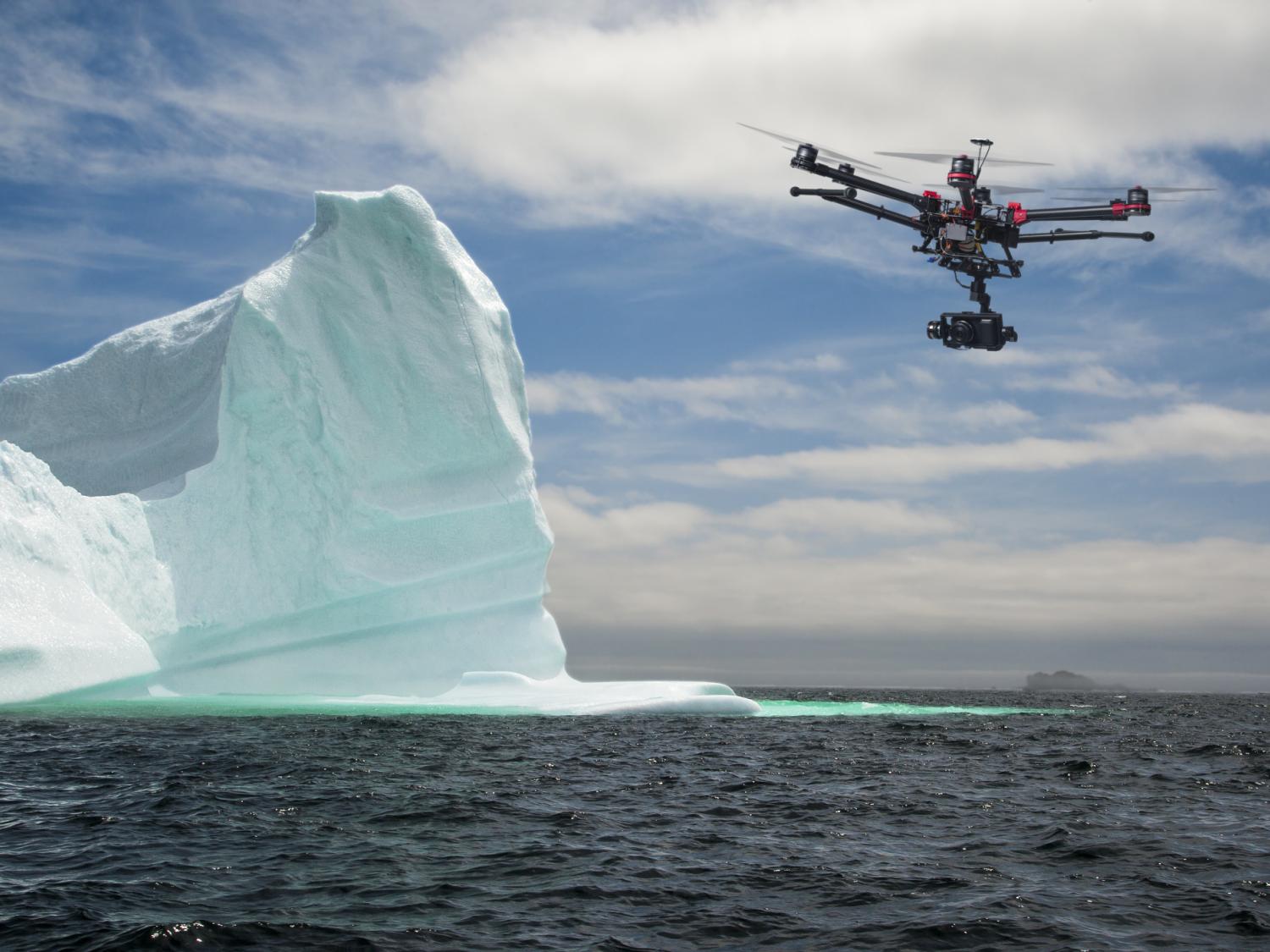 Drone flies by iceberg