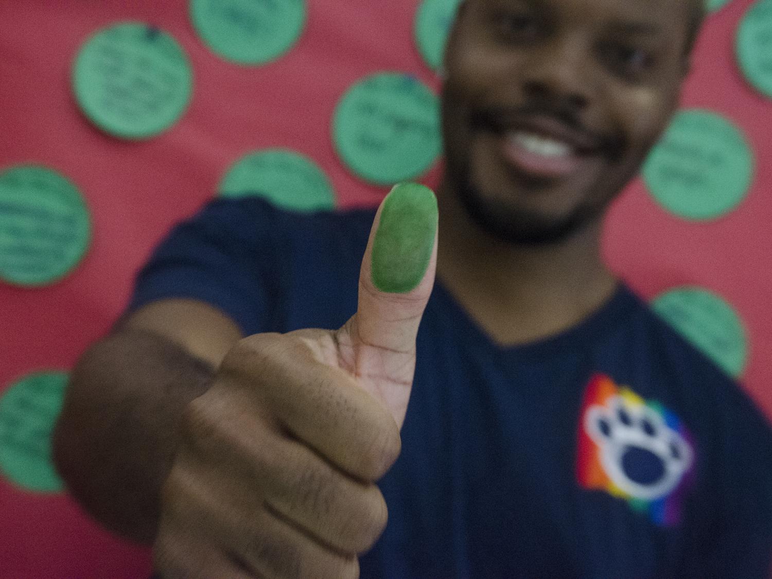 A student gives the thumbs up