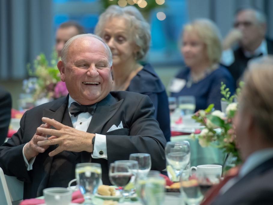 Tom Hagen reacts to remarks during a ceremony honoring him on May 23.