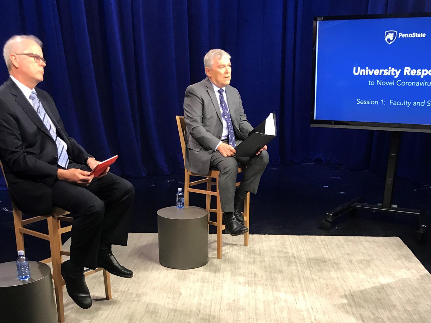 Penn State Executive Vice President and Provost Nick Jones, left, and Penn State President Eric Barron on stage for the faculty and staff Town Hall on March 24.