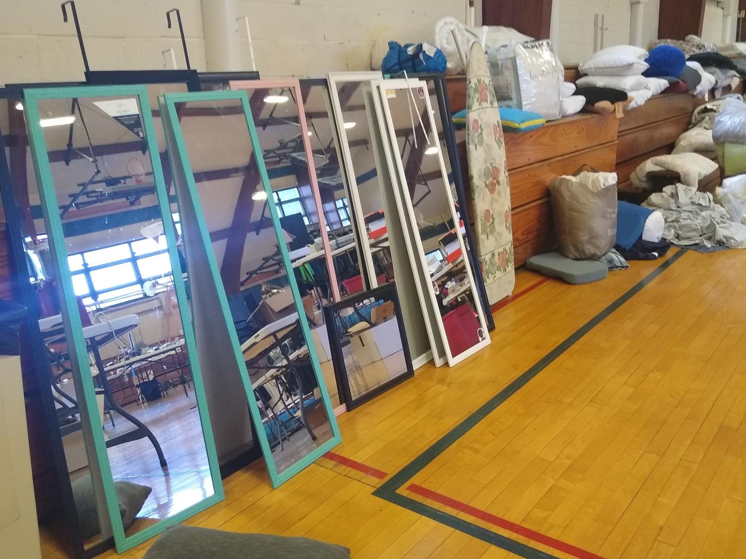 Stacked mirrors and other housewares at the Penn State Behrend Trash 2 Treasure sale.