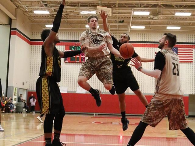 Tristan Pierce and Sam Roselli in action on the court. 