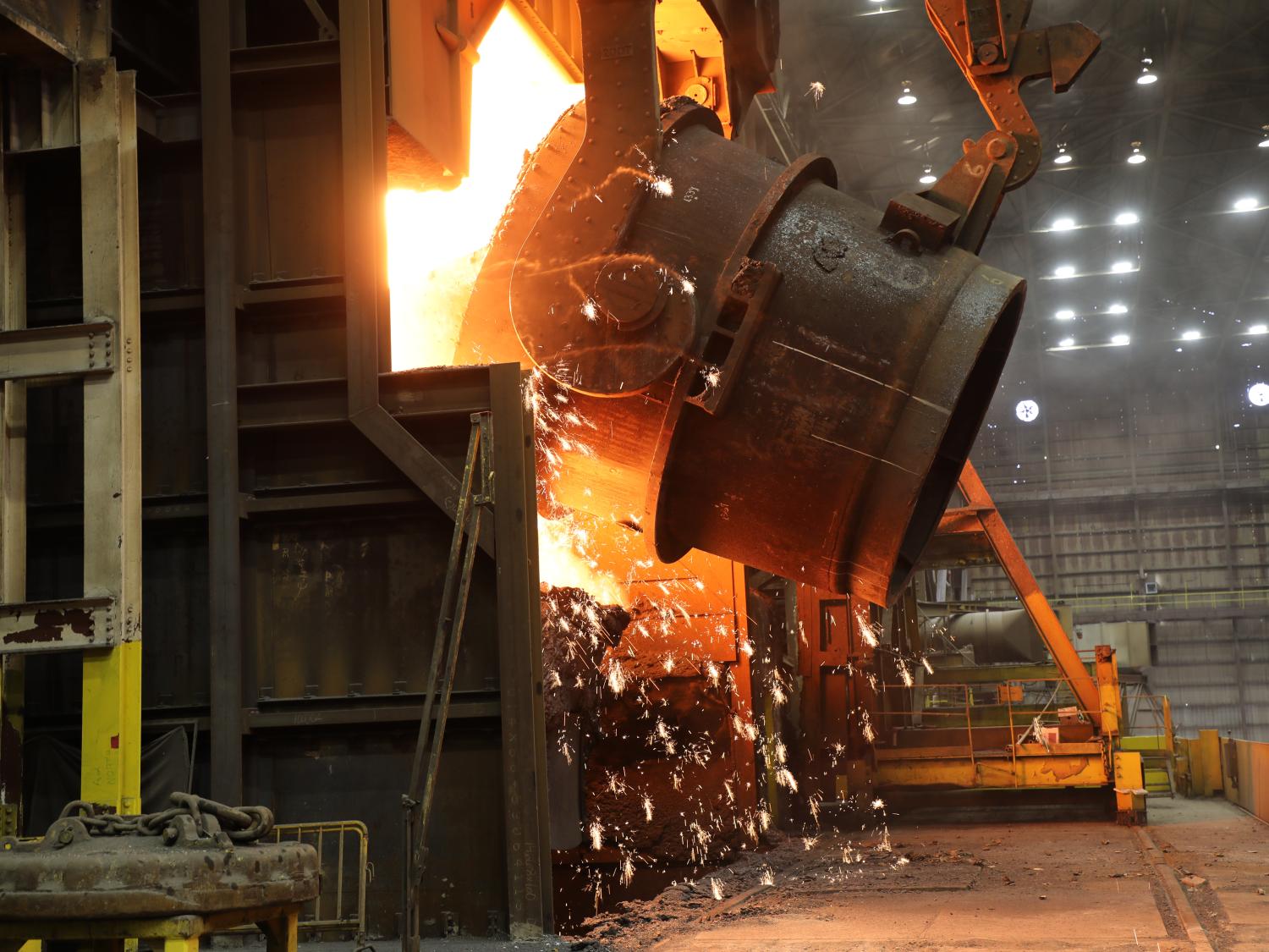 A ladle of molten iron is poured into a U.S. Steel blast furnace.