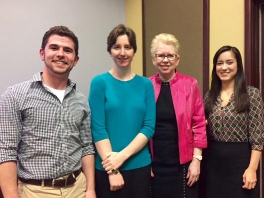 three undergraduate students standing with the dean of University Libraries and Scholarly Communications