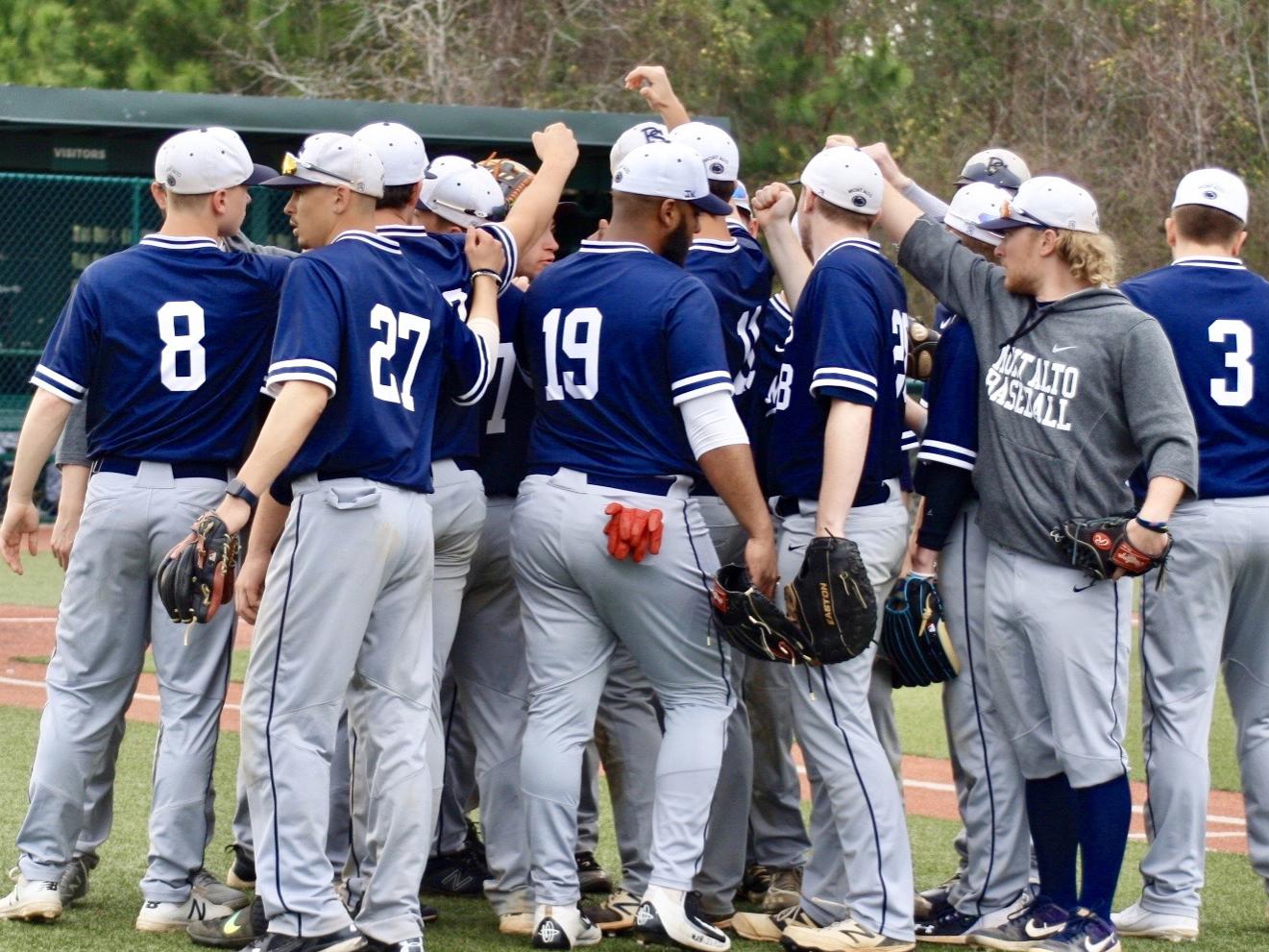Penn State Mont Alto baseball players huddle on the field