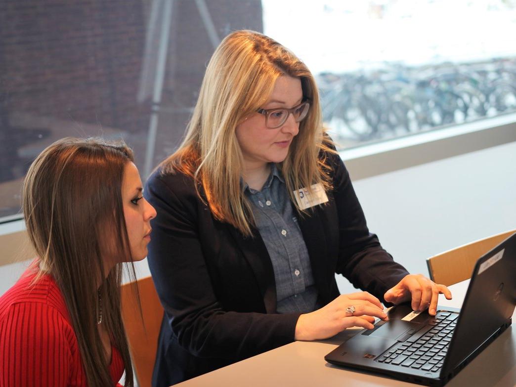 Student Christina McMahon and IST research consultant Carmen Cole discuss research citations.