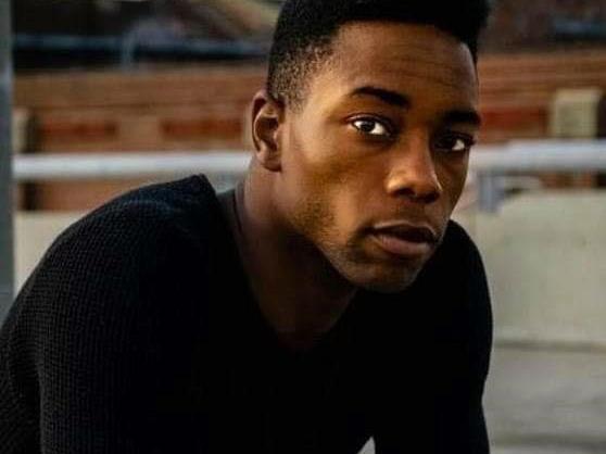 A man looks at the camera.