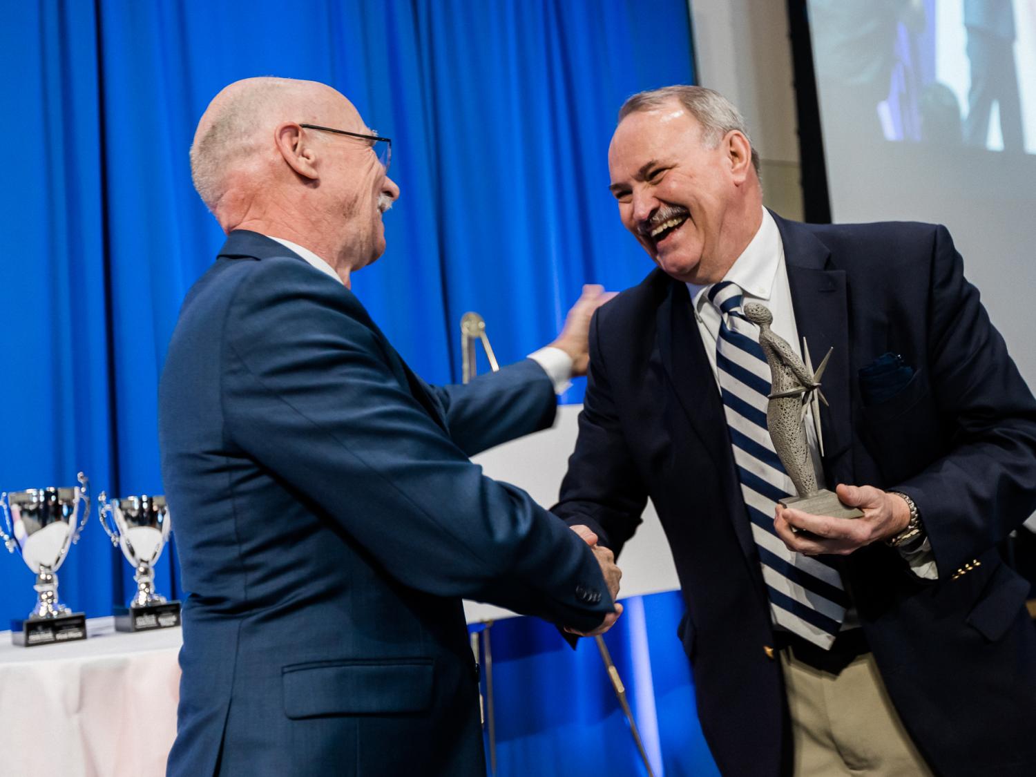 Dr. James Adair receives the Invent Penn State Inventor of the Year award from Vice President for Research Neil Sharkey