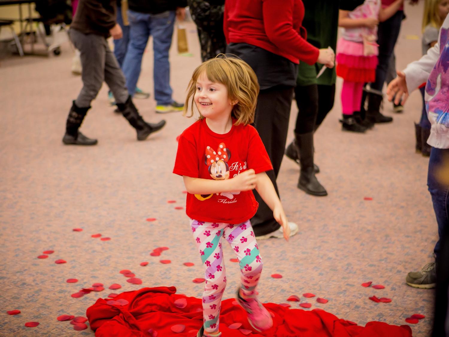 A young participant enjoys the Hearts and Showers activity during the Valentine's Day Extravaganza, held Saturday, Feb. 10, at North East School District’s Earle C. Davis Primary school. 