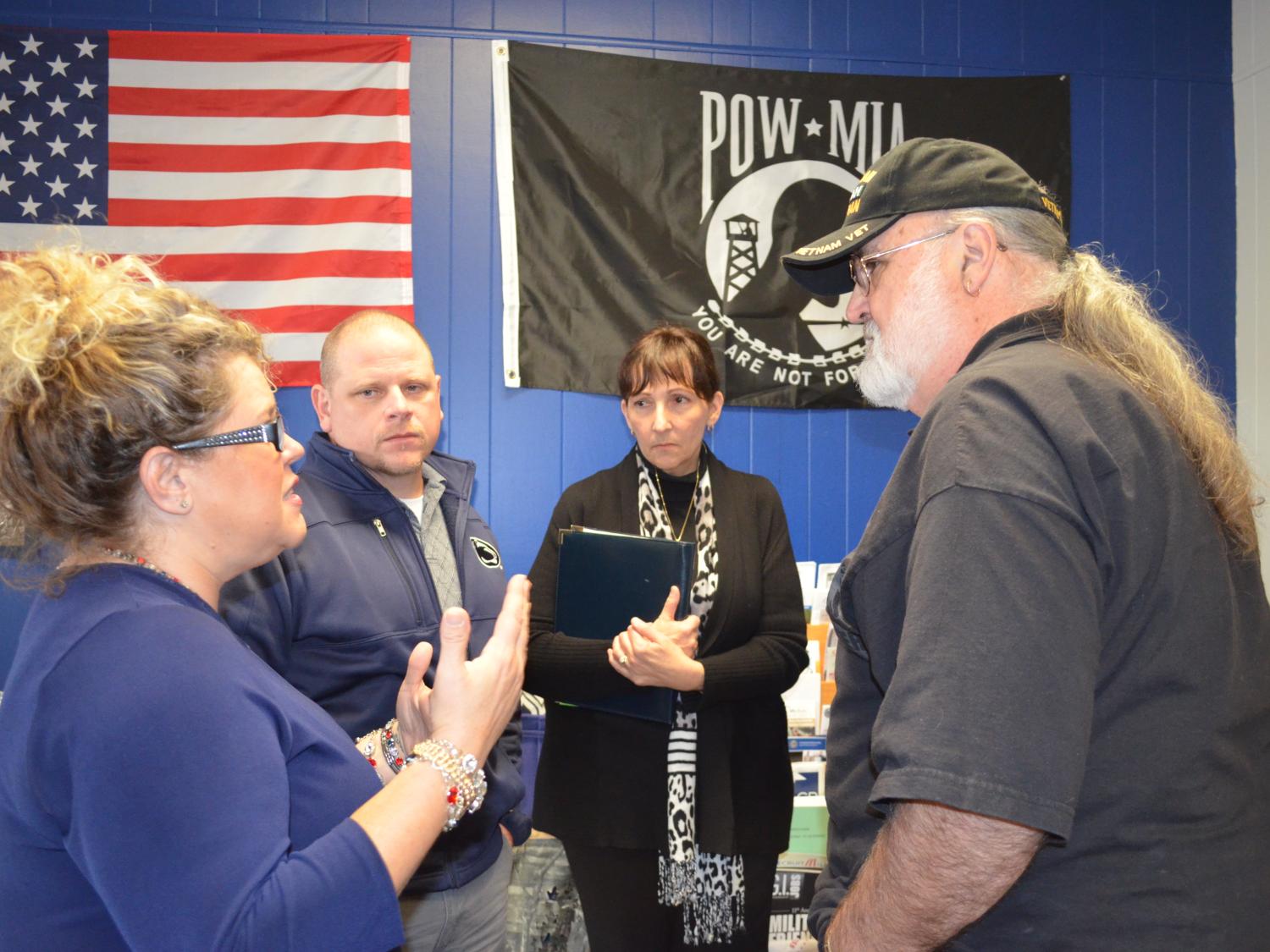 Student Wendy Caszatt speaks to staff and guests during the Veterans Center grand opening celebration.