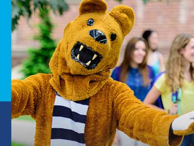 Lion mascot with outstretched arms and Virtual Visits sign